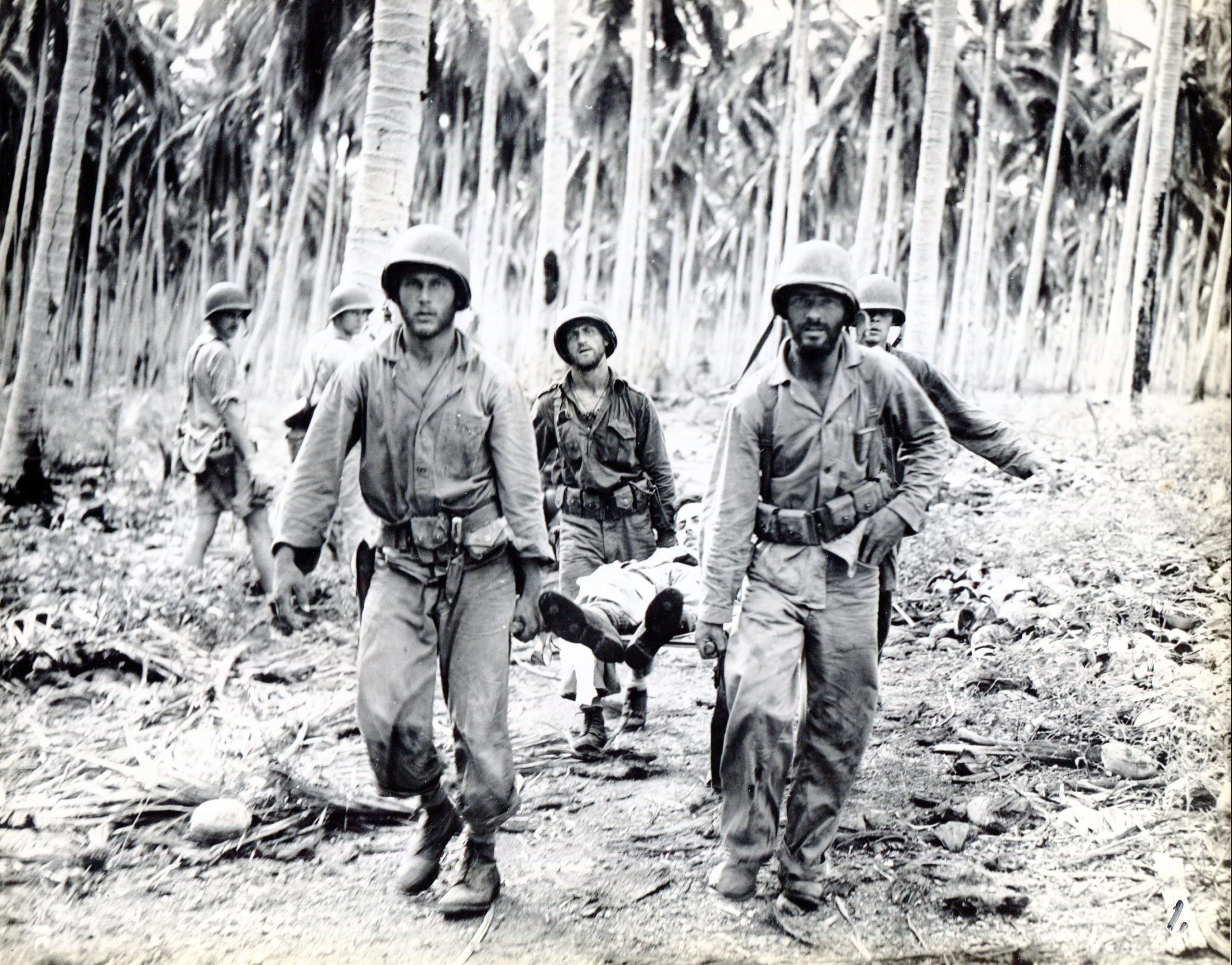 https://missingmarines.com/wp-content/uploads/2018/06/guadalcanal_carry_wounded-scaled.jpg